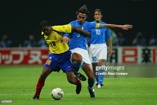 Clever Chala of Ecuador holds off Paolo Maldini of Italy during the Group G match of the World Cup Group Stages played at the Sapporo Dome, Sapporo,...