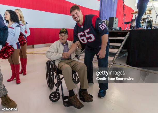 Houston Texans center Greg Mancz poses with WWII veteran First Lieutenant Louie Richard during the Super Bowl LI NFL-USO Salute to Military Service...