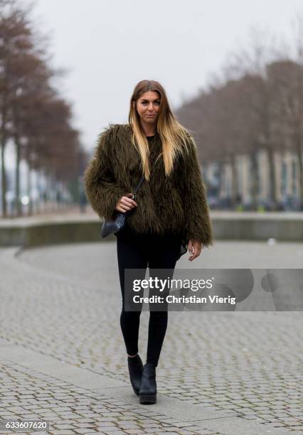 Malin Svensson wearing an olive fur jacket, black leggings, ankle boots during the Copenhagen Fashion Week Autumn/Winter 17 on February 2, 2017 in...