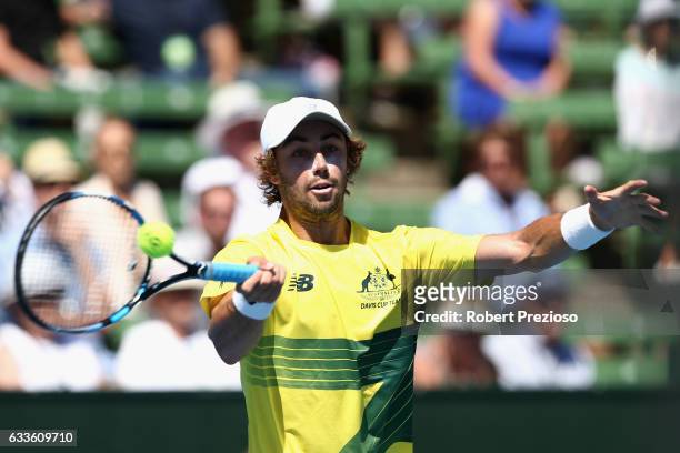 Jordan Thompson of Australia plays a forehand in his singles match against Jiri Vesely of Czech Republic during the first round World Group Davis Cup...