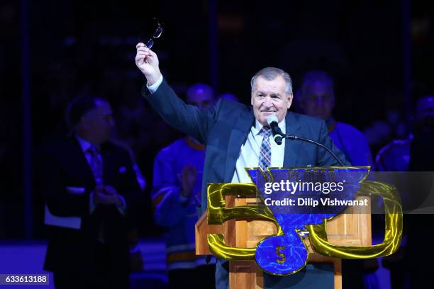 Former St. Louis Blues player Bob Player acknowledges the crowd during his number retirement ceremony prior to a game between the St. Louis Blues and...