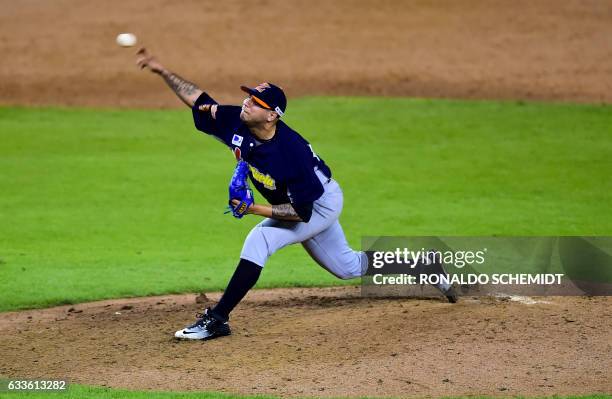 Pitcher Hassan Pena of Aguilas del Zulia from Venezuela throws against Criollos de Caguas from Puerto Rico during the Caribbean Baseball Series, at...