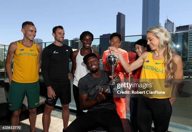 Usain Bolt, captain of the Bolt All-Stars poses with the Nitro Athletics Melbourne World Cup and Ryan Gregson of Australia, Matthew Wyatt of New...