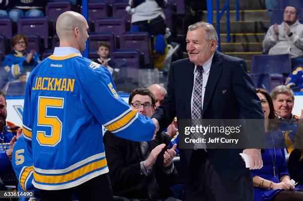 Bob Plager shakes hands with Barret Jackman during Plager's number retirement ceremony prior to a game between the Toronto Maple Leafs and the St....