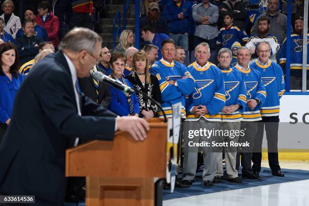 Bernie Federko Brett Hull Kelly Plager son of Barclay Plager Bobby Gassoff Jr son of Bob Gassoff and Al MacInnis watch as Bob Plager speaks during...