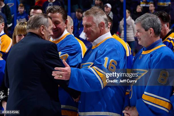 Bob Plager shakes hands with Brett Hull during Plager's number retirement ceremony prior to a game between the Toronto Maple Leafs and the St. Louis...