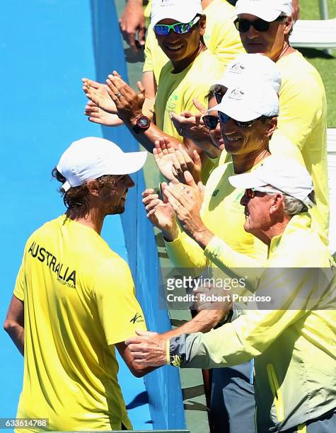 Jordan Thompson of Australia is congratulated by team-mates after a win in his singles match against Jiri Vesely of Czech Republic during the first...