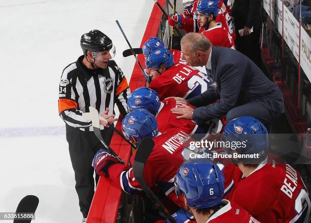 Head coach Michel Therrien of the Michel Therrien gets an explanation from referee Brad Meier during the game against the Philadelphia Flyers at the...