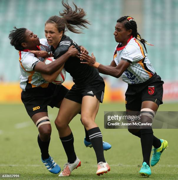 Ruby Tui of New Zealand is tackled during the pool match between New Zealand and Papua New Guinea in the 2017 HSBC Sydney Sevens at Allianz Stadium...