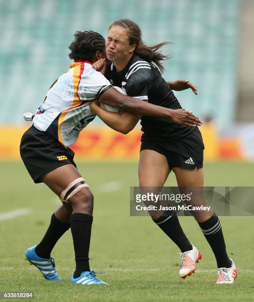Ruby Tui of New Zealand is tackled during the pool match between New Zealand and Papua New Guinea in the 2017 HSBC Sydney Sevens at Allianz Stadium...