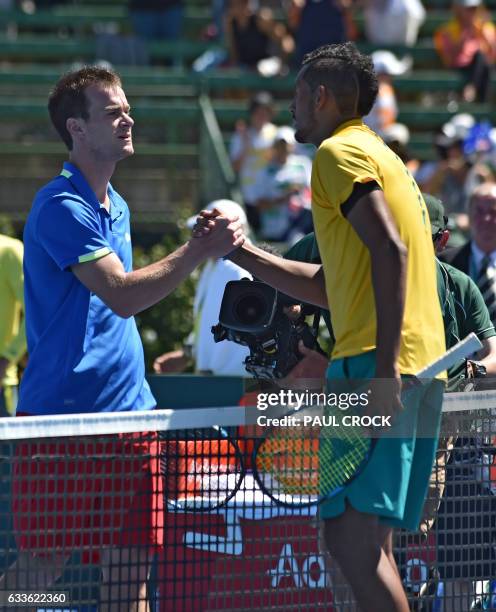 Nick Kyrgios of Australia and and Jan Satral of the Czech Republic shake hands after Australia won the second tennis Davis Cup world group first...