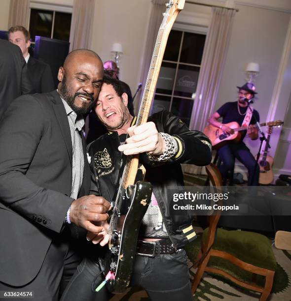 Former NFL player Marshall Faulk and musician Michael Franti perform during the #Culinary Kickoff at Brennan's Restaurant on February 2, 2017 in...