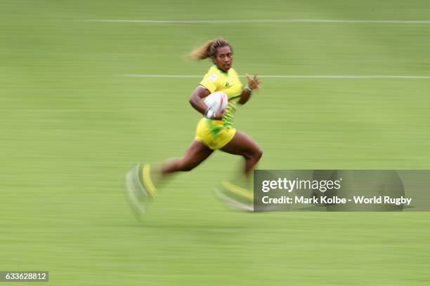 Ellia Green of Australia breaks away to score a try during the womens Pool B match between Australia and Ireland in the 2017 HSBC Sydney Sevens at...