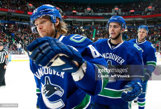 Philip Larsen of the Vancouver Canucks is congratulated by teammates after scoring during their NHL game at Rogers Arena February 2, 2017 in...