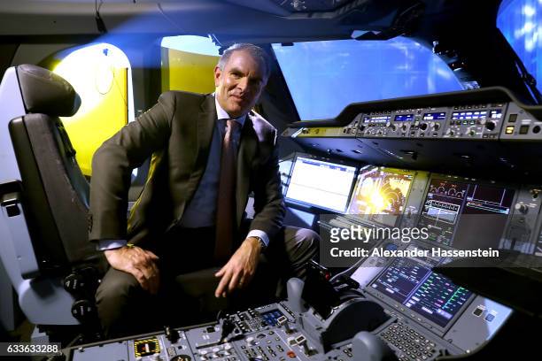 Carsten Spohr, Chairman of German airline Lufthansa, sits in the pilot's seat in the cockpit of the German airline's first ever Airbus A350-900...