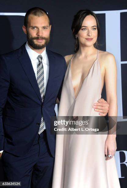 Actor Jamie Dornan and actress Dakota Johnson arrive for the Premiere Of Universal Pictures' "Fifty Shades Darker" at The Theatre at Ace Hotel on...