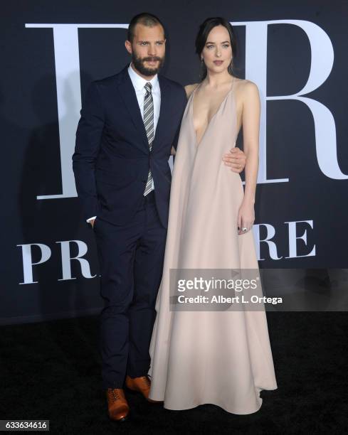 Actor Jamie Dornan and actress Dakota Johnson arrive for the Premiere Of Universal Pictures' "Fifty Shades Darker" at The Theatre at Ace Hotel on...