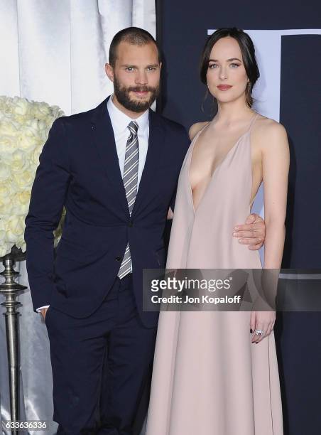 Actor Jamie Dornan and actress Dakota Johnson arrive at the Los Angeles premiere "Fifty Shades Darker" at The Theatre at Ace Hotel on February 2,...