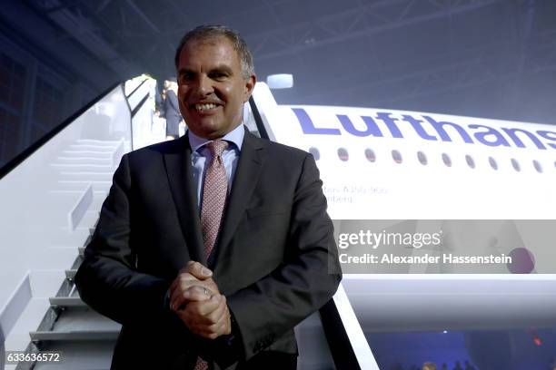 Carsten Spohr, Chairman of German airline Lufthansa, stands under the company's first Airbus A350-900 passenger plane during a roll-out event at...