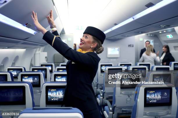 Airhostess of German airline Lufthansa, stands in cabine at the passenger deck of the company's first Airbus A350-900 passenger plane during a...