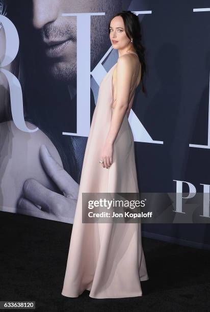 Actress Dakota Johnson arrives at the Los Angeles premiere "Fifty Shades Darker" at The Theatre at Ace Hotel on February 2, 2017 in Los Angeles,...
