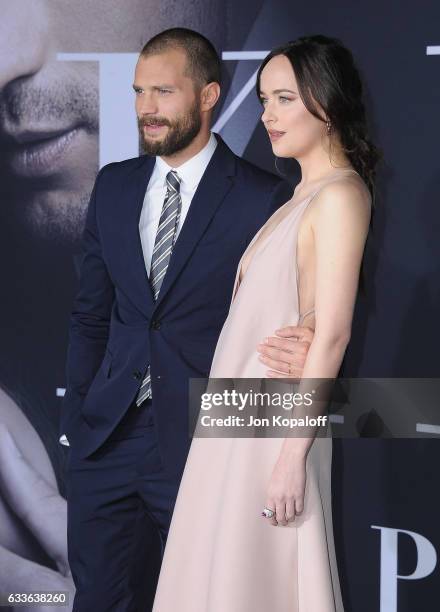 Actor Jamie Dornan and actress Dakota Johnson arrive at the Los Angeles premiere "Fifty Shades Darker" at The Theatre at Ace Hotel on February 2,...