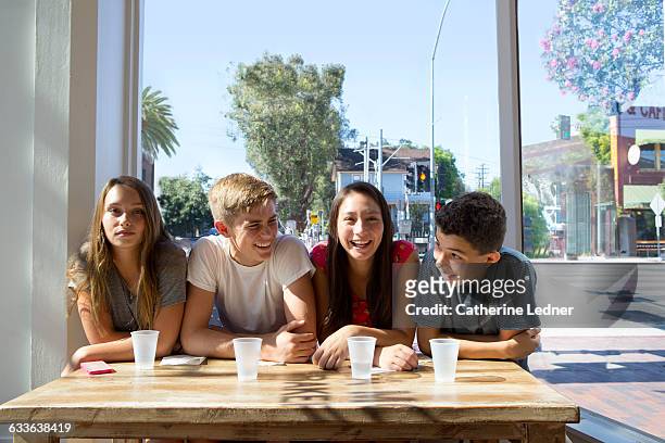 teens at a bright cafe - teenagers only ストックフォトと画像