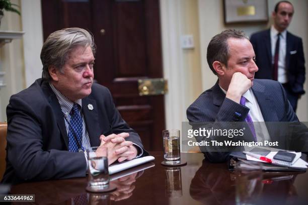 White House senior advisers Steve Bannon, left, and White House Chief of Staff Reince Priebus listen during a meeting with House and Senate...