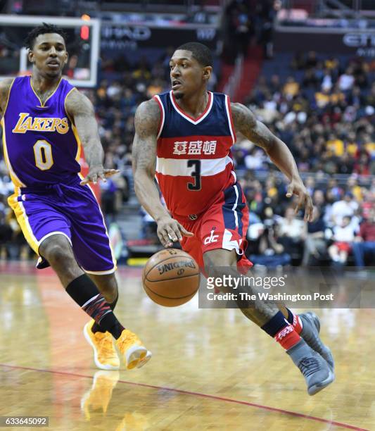 Washington Wizards guard Bradley Beal drives to the basket against Los Angeles Lakers guard Nick Young at The Verizon Center in Washington, DC on...