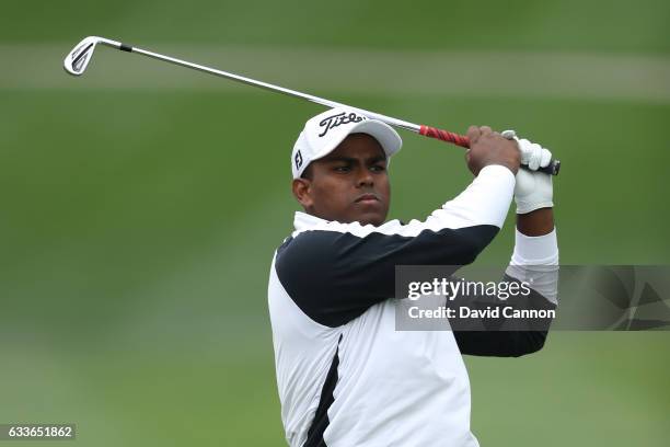 Amateur Rayhan Thomas of India hits his second shot on the 1st hole during the second round of the Omega Dubai Desert Classic at Emirates Golf Club...