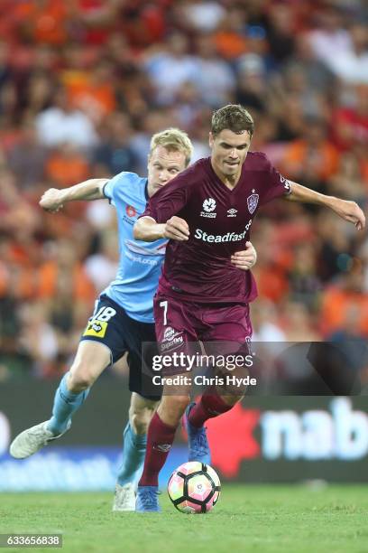 Matthew Simpson of Sydney FC and Thomas Kristensen of the Roar compete fot the ball during the round 18 A-League match between the Brisbane Roar and...