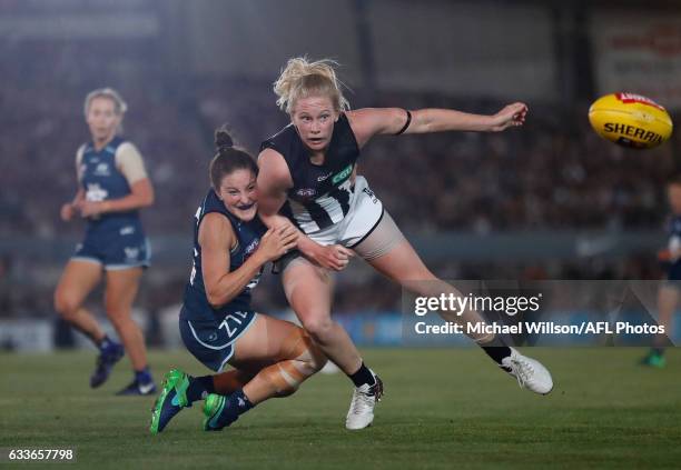 Sarah D'Arcy of the Magpies is tackled by Shae Audley of the Blues during the 2017 AFLW Round 01 match between the Carlton Blues and the Collingwood...