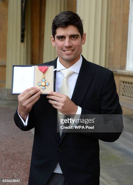 England cricket captain Alastair Cook poses for a photo after being awarded a CBE by the Prince of Wales at an Investiture ceremony at Buckingham...