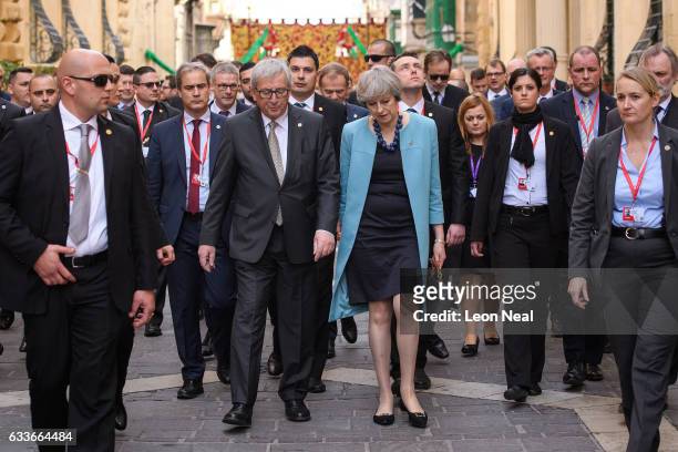 President of the European Union Jean-Claude Juncker and British Prime Minister Theresa May walk between photo calls at the Malta Informal Summit on...