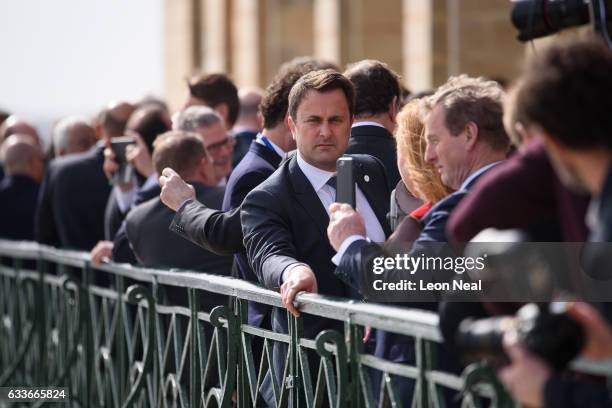 Prime Minister of Luxembourg, Xavier Bettel talks with other EU leaders at the EU Informal Summit on February 3, 2017 in Valletta, Malta. Theresa May...