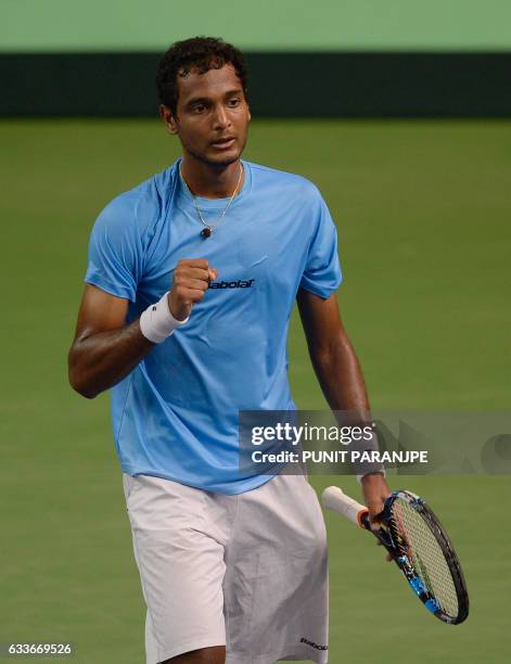 India's Ramkumar Ramanathan reacts after winning a point during a Davis Cup singles tennis match against New Zealand's Jose Statham at the Balewadi...