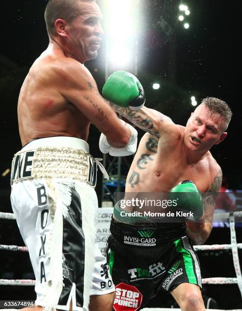 Australian boxers Anthony Mundine and Danny Green fight during their cruiserweight bout at Adelaide Oval on February 3, 2017 in Adelaide, Australia.