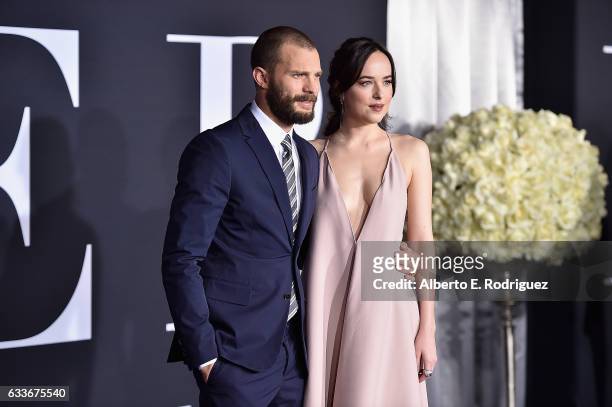 Actors Jamie Dornan and Dakota Johnson attend the premiere of Universal Pictures' 'Fifty Shades Darker' at The Theatre at Ace Hotel on February 2,...