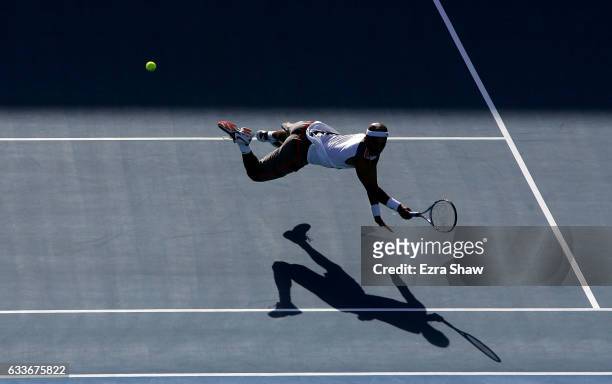 James Blake of the United States dives for the ball during his match against Fabrice Santoro of France during day two of the Medibank International...