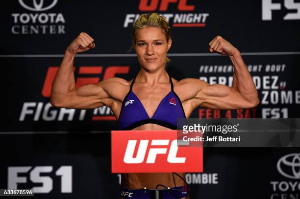 Felice Herrig poses on the scale during the UFC Fight Night weigh-in at the Sheraton North Houston at George Bush Intercontinental on February 3,...