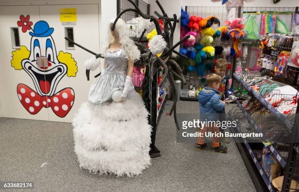 Carnival 2017. For everyone the right carnival disguise. Scene with wedding dress in a department store for carnival items.