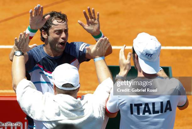 Paolo Lorenzi of Italy celebrates with teammates after winning the singles match between Guido Pella and Paolo Lorenzi as part day 1 of the Davis Cup...