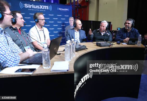 Rob Riggle, second from left, Joe Buck, third from left, and New England Patriots owner Robert Kraft, second from right, visits the SiriusXM set at...