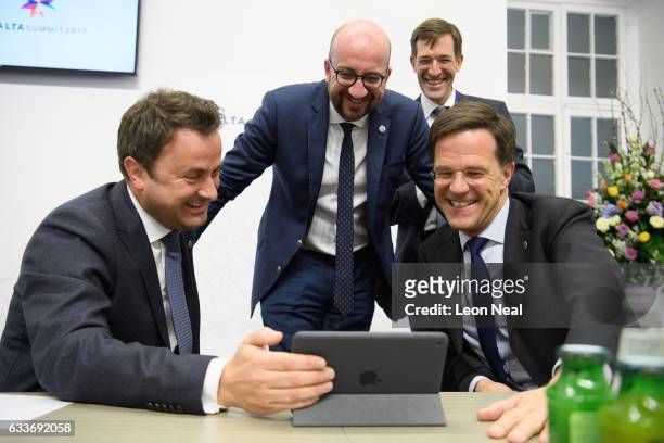 Prime Minister of Luxembourg Xavier Bettel , Prime Minister of Belgium Charles Michel and Prime Minister of the Netherlands Mark Rutte laugh as they...