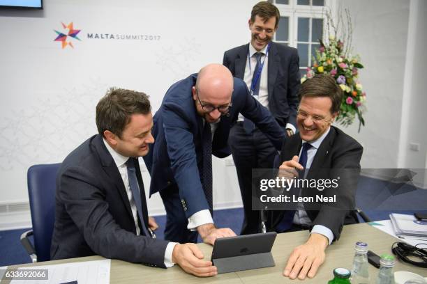 Prime Minister of Luxembourg Xavier Bettel , Prime Minister of Belgium Charles Michel and Prime Minister of the Netherlands Mark Rutte laugh as they...