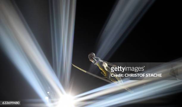 Norwegian Daniel Andre Tande soars during his qualification jump for the FIS ski jumping World Cup flying hill individual competition in Oberstdorf,...