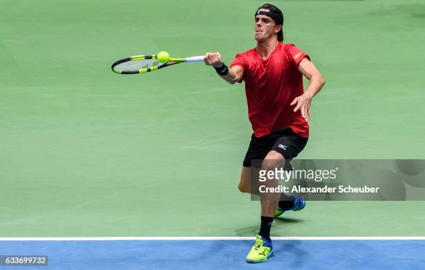 Arthur De Greef of Belgium in action against Alexander Zverev of Germany during day one of the Davis Cup World Group first round between Germany and...