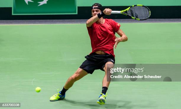 Arthur De Greef of Belgium in action against Alexander Zverev of Germany during day one of the Davis Cup World Group first round between Germany and...