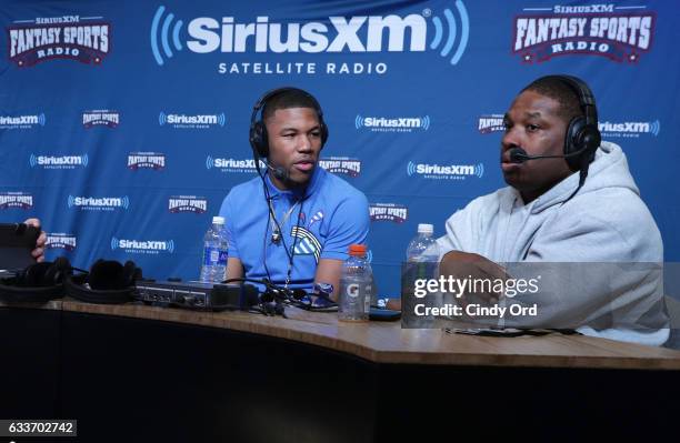 Dallas Cowboys wide receiver Terrance Williams, left, visits the SiriusXM set at Super Bowl LI Radio Row at the George R. Brown Convention Center on...