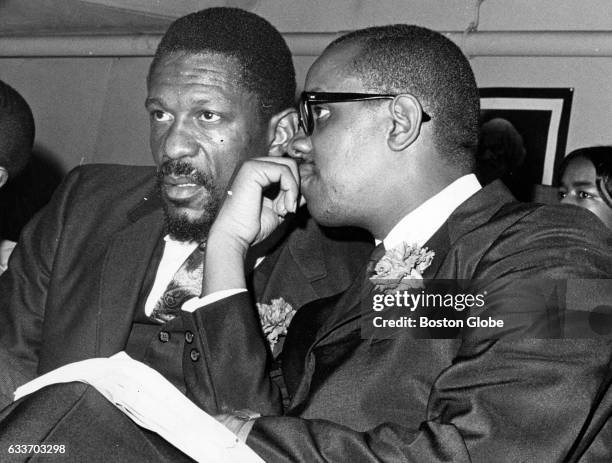 Boston Celtics player Bill Russell and Reverend Virgil Wood sit at the Freedom Graduation exercise of the Patrick T. Campbell Junior High School in...